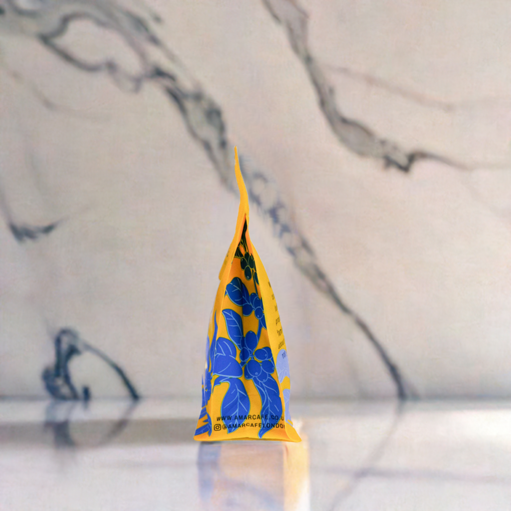 a square picture of a coffee bag on a marble counter top